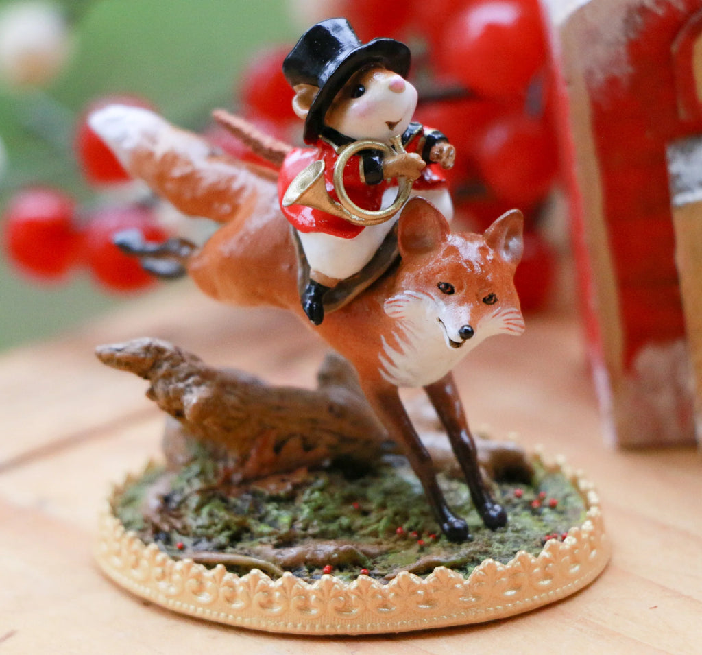 The Wee Forest Folk Tiny Collectible - Lords a-Leaping features a hand-sculpted mouse in a top hat and red jacket riding a fox, holding a horn, on a greenery base with gold trim.