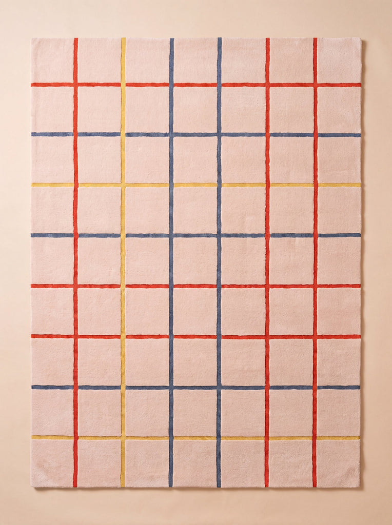 Introducing the Little Forest Animals Silk Rug — The Palette: This rectangular children’s rug features a playful grid pattern formed by red, yellow, and blue lines on a light beige background. Designed to brighten any child’s space, its evenly spaced vertical and horizontal lines create a stylish look—making it the perfect designer kids room rug.