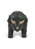 The Konges Sloejd Money Bank - Dino is a black and gray triceratops with beige horns and spikes, serving as both a playful toy and a decorative piggy bank for saving money.