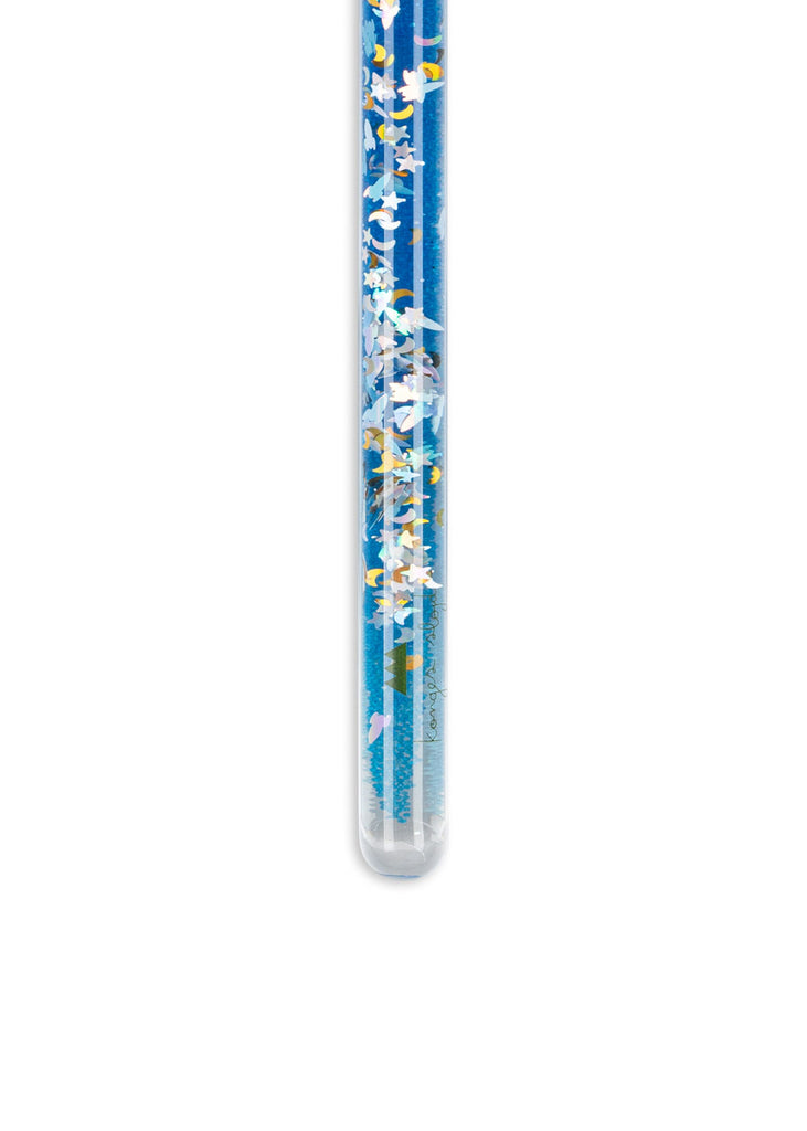 A clear test tube filled with blue and white beads and confetti stands upright against a white background, resembling the Konges Sloejd Magical Glitter Wand - Rocket.