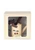 The Konges Sloejd Garden Set is a cream kids’ gardening set in a box with a clear window, featuring a cherry-decorated watering can and brown tools. The box is labeled "GARDEN SET" at the bottom.