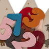 Colorful felt numbers (2, 3, 5, 7, 9) overlap on a beige background with embroidered animals and stars—ideal inspiration from the Konges Sloejd Birthday Crown - Dino.