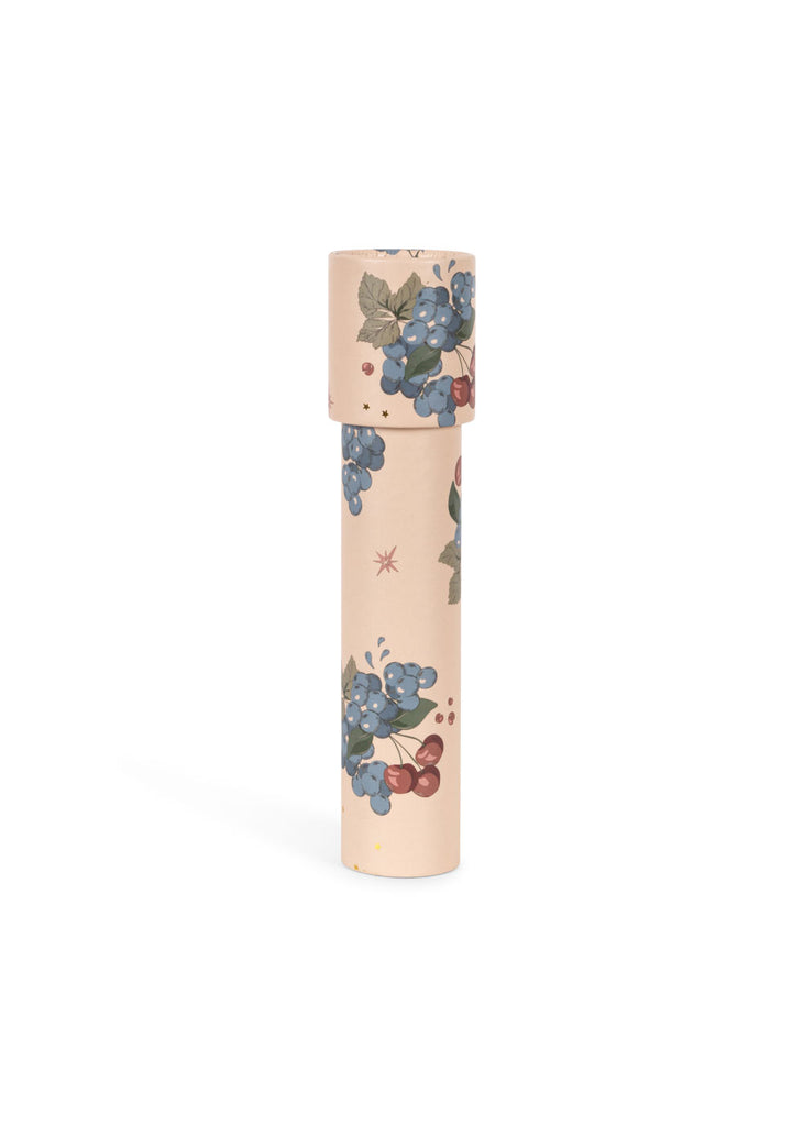 The Konges Sloejd Kaleidoscope - Cremona is a cylindrical, FSC-certified kaleidoscope with a light beige background, featuring blue and red berry illustrations and green leaves.
