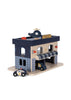 The Konges Sloejd Wooden Police Station is made from FSC-certified wood and features a blue and gray station with a striped awning, "POLICE" sign, toy helicopter on the roof, plus police car and van.