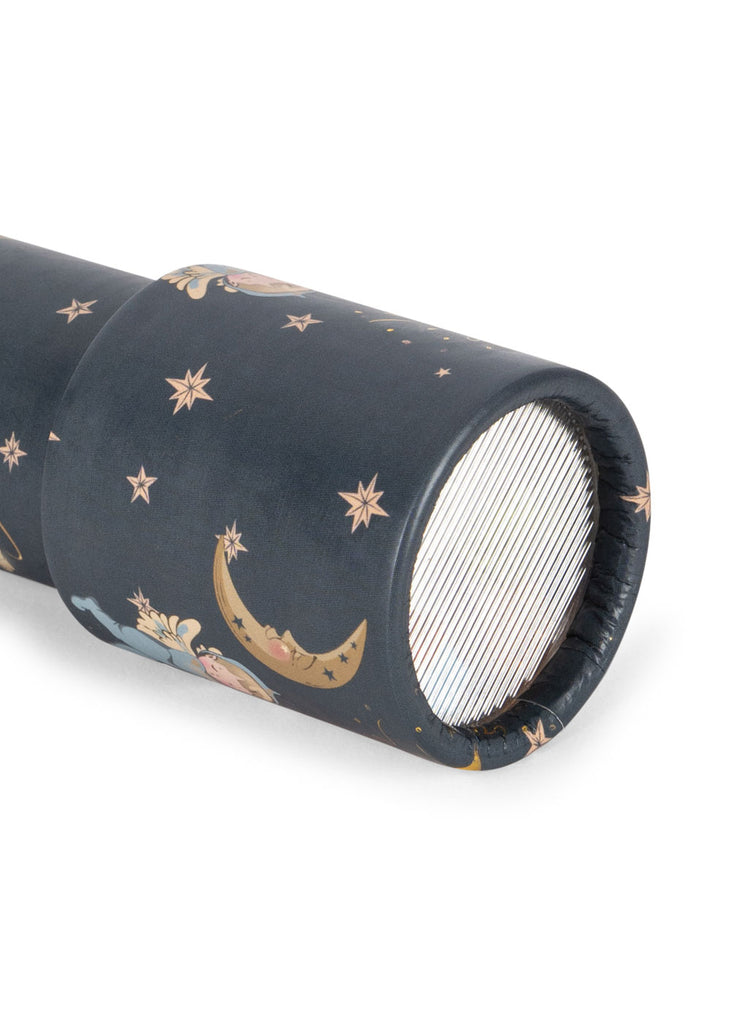 A close-up of the Konges Sloejd Kaleidoscope - Lucia, dark blue with stars, crescent moons, and colorful pearls; its striped viewing lens is turned toward the camera.