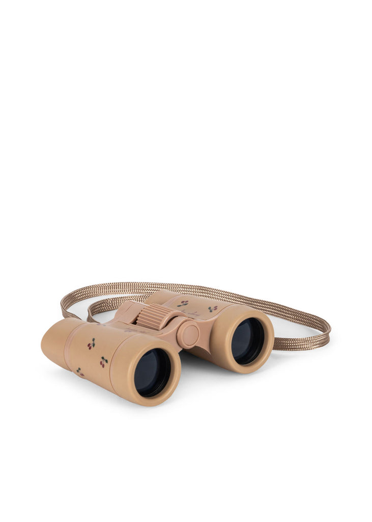 Konges Sloejd Explorer Binoculars - Cherry, featuring a patterned strap, lightweight design, and adjustable focus, are displayed on a white background.