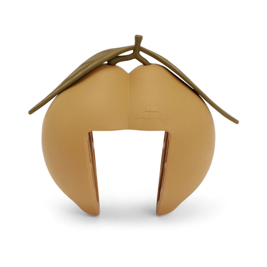 A lemon-shaped door stopper in tan with green leaves on top, featuring a smooth matte finish and a simple modern design. CE-tested for quality and safety—designed by Konges Sloejd to securely hold doors open.