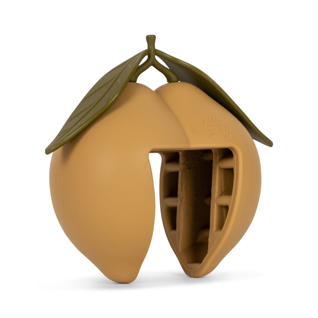 The CE-tested Konges Sloejd Door Stopper - Lemon is a silicone lemon-shaped mold with green leaves and a wedge opening revealing inner compartments—ideal for making ice or serving as a fun and functional silicone door stopper.