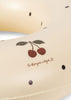 Close-up of the Konges Sloejd Junior Swim Ring in Navy Dot, featuring black polka dots and an illustration of two cherries with green leaves above the handwritten text "konges slojd." Final Sale.