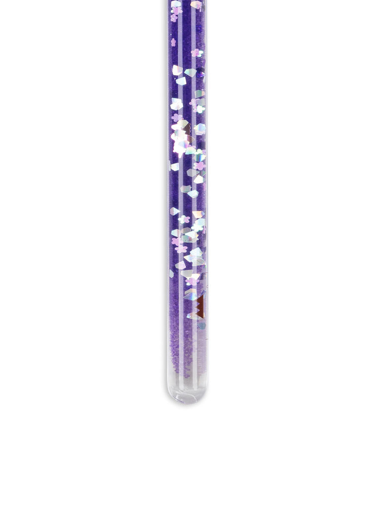 The Konges Sloejd Magical Glitter Wand - Unicorn, a clear tube with purple liquid and floating iridescent hexagonal glitter, is displayed against a white background.
