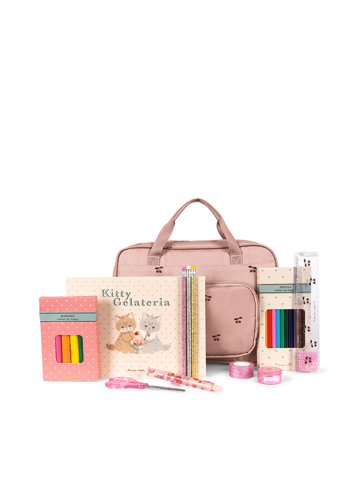 The Konges Sloejd Holiday Essentials Bag - Cherry is a pink kids stationery set with a shoulder bag, kitten notebooks, colored pencils, pens, sticky notes, pink tape & other school supplies—ideal as a travel activity kit or holiday essentials.