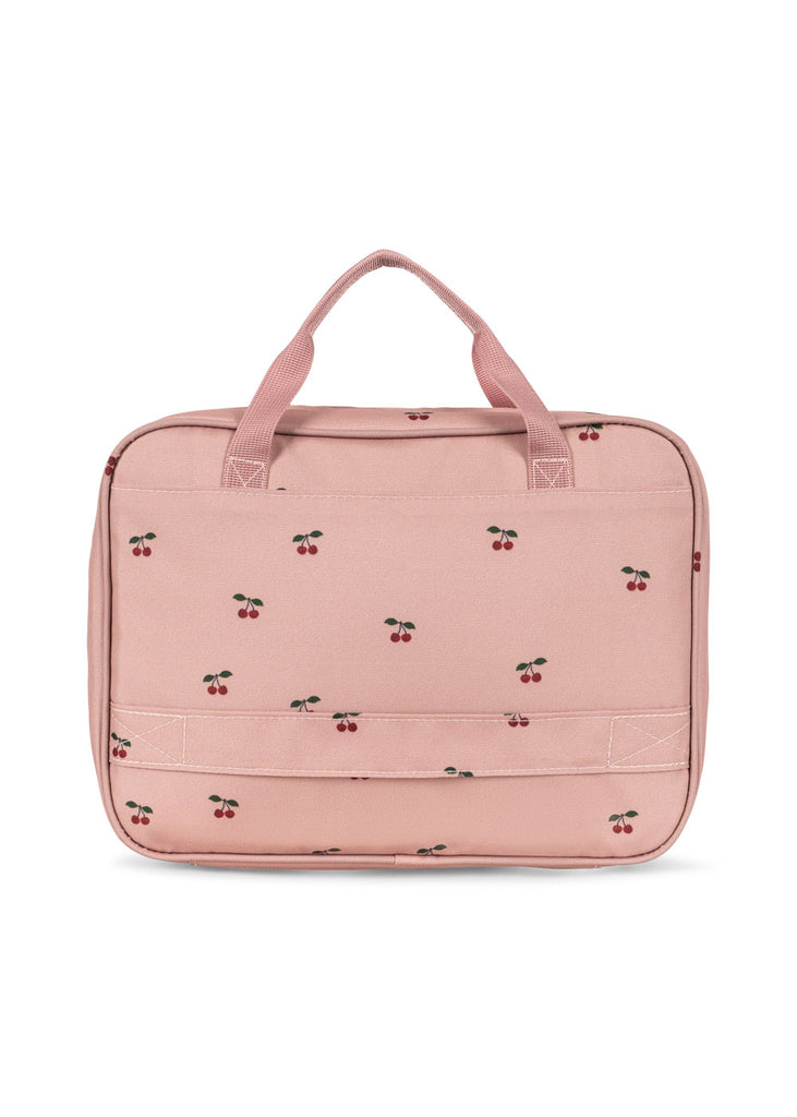 The Konges Sloejd Holiday Essentials Bag - Cherry is a light pink bag with two handles, a front pocket, and a cherry pattern—ideal for carrying your travel activity kit or kids’ stationery set wherever you go.