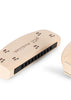 The Konges Sloejd Petit Music Set - Glossy Cherry features a cream-colored harmonica with brown floral designs and "petit musicien" on top, displayed against a white background.