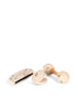The Konges Sloejd Petit Music Set - Glossy Cherry features three cream-colored wooden instruments—a harmonica, castanets, and double-headed rattle—each adorned with black dot and line designs, displayed on a white background.