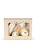 The Konges Sloejd Petit Music Set - Glossy Lemon comes in a beige gift box labeled "Magical music," featuring maracas, a harmonica, and a round shaker—all wooden instruments with yellow lemon illustrations, visible through a clear window.