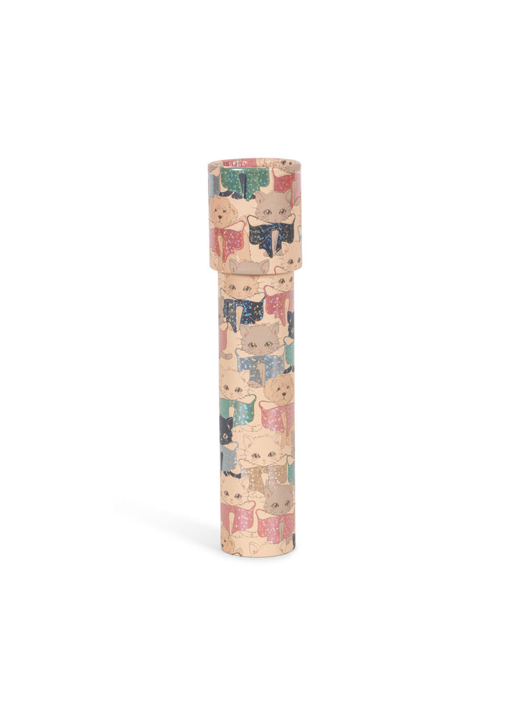 The Konges Sloejd Kaleidoscope - Like Cats and Dogs stands upright on a white background, its cylindrical body crafted from FSC-certified materials and adorned with a playful cat pattern. Inside, colorful pearls swirl to create dazzling patterns, promising endless visual delight.