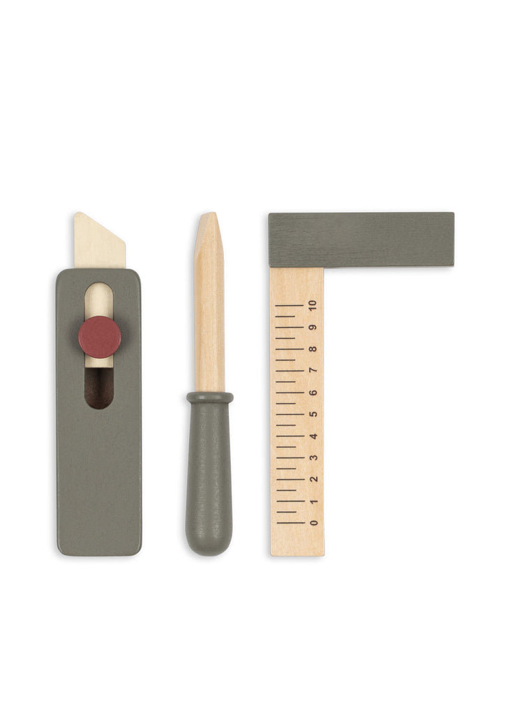 Three toy woodworking tools—the perfect additions to the Konges Sloejd Tool Bench—include a grey and wood hand plane, a screwdriver with a grey handle, and an L-shaped ruler with measurement markings, all arranged vertically on a white background.