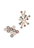A set of toy bolts and hexagonal nuts from the Konges Sloejd Tool Bench, in muted shades of gray, beige, and red, are arranged on a white background. Reminiscent of pieces from a children’s workbench, the bolts are clustered together while the nuts form a loose geometric pattern.