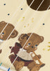 Illustration of a brown teddy bear playing a trumpet, surrounded by musical notes, with guitar strings and the Konges Sloejd Wooden Ukulele - Teddy Bear crossing over the image, highlighting the joy of exploring kids musical instruments.