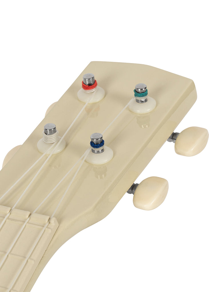 Close-up of the Konges Sloejd Wooden Ukulele - Teddy Bear, featuring a cream-colored headstock with four tuning pegs accented by colored rings and white strings, set against a plain white background—an inviting kids’ musical instrument perfect for young beginners.