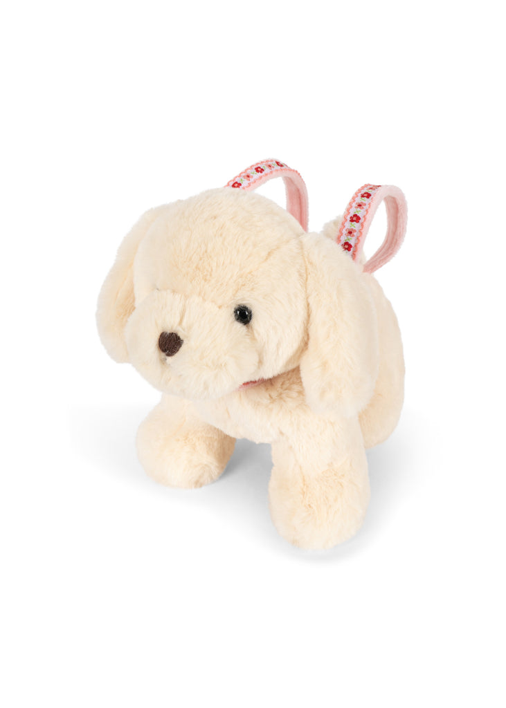 The Konges Sloejd Puppy Bag - Off White features light cream fur and pink patterned backpack straps, shown here against a white background.