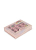 The Konges Sloejd ABC Jewelry Set is a pink bead box with a rainbow and unicorn lid, featuring colorful jewelry pieces and letter pearls, all neatly organized in separate compartments.