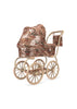 Konges Sloejd Mini Doll Pram - Sparkly Cherry Sequin featuring a rose-gold sequined fabric body with a red cherry pattern, mounted on a tan frame with four large spoked wheels.
