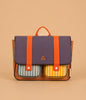 The Sticky Lemon School Bag | Better Together | Leather Ball features a purple flap, orange straps, brown sides, and two front pockets—one blue-striped, one yellow-striped—made from waterproof recycled RPET nylon and Global Recycled Standard certified.