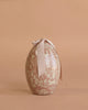 The Maileg Easter Egg with Bunny features a floral-patterned, egg-shaped box topped with a large cream ribbon—ideal for gifting this season and pairing beautifully with a plush bunny.