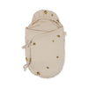 The Konges Sloejd Doll Sleeping Bag - Lemon is a beige swaddle with a hood, made from organic cotton and decorated with a small lemon print. It features two side ties to secure the wrap.
