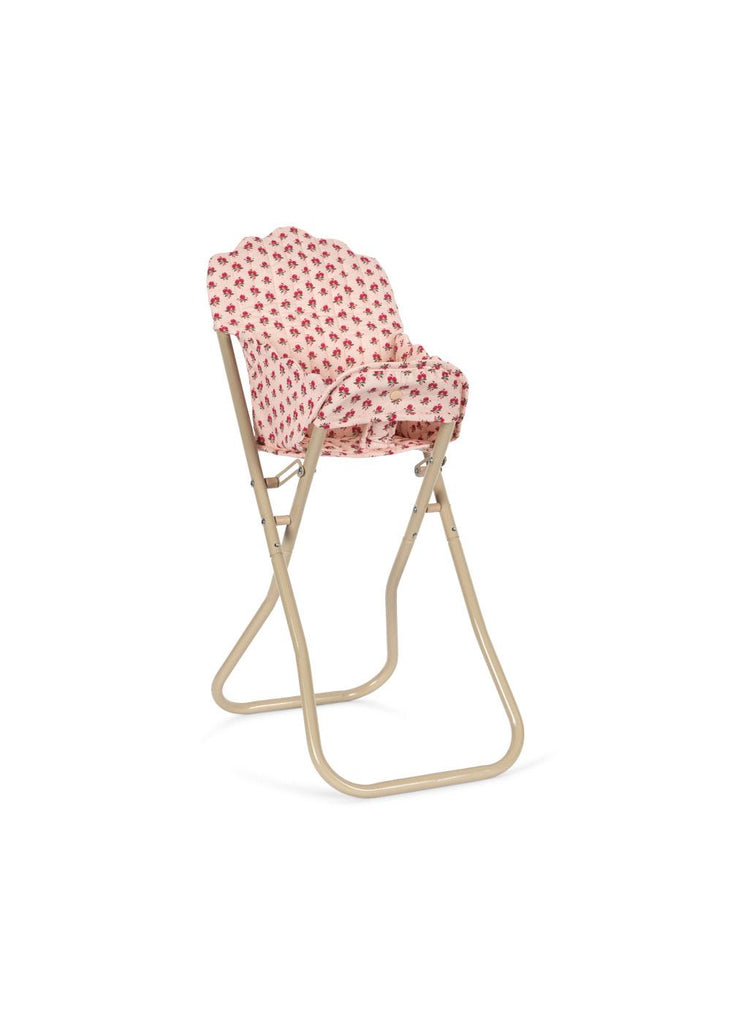 The Konges Sloejd High Chair - Rosie Rose is a beige foldable doll chair with scallop edges, featuring a scalloped backrest and seat covered in pink floral-patterned fabric, shown on a white background.
