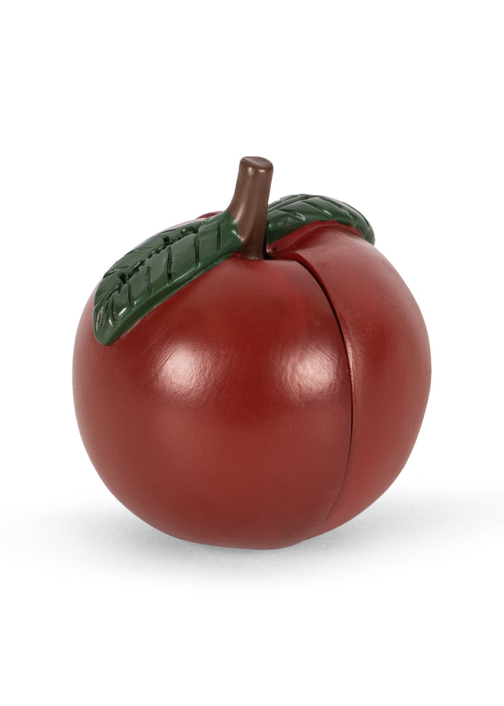 A dark red, fruit-shaped Konges Sloejd Mini Surprise House - Cherry with a green stem and leaf on top, perfect for a miniature world.