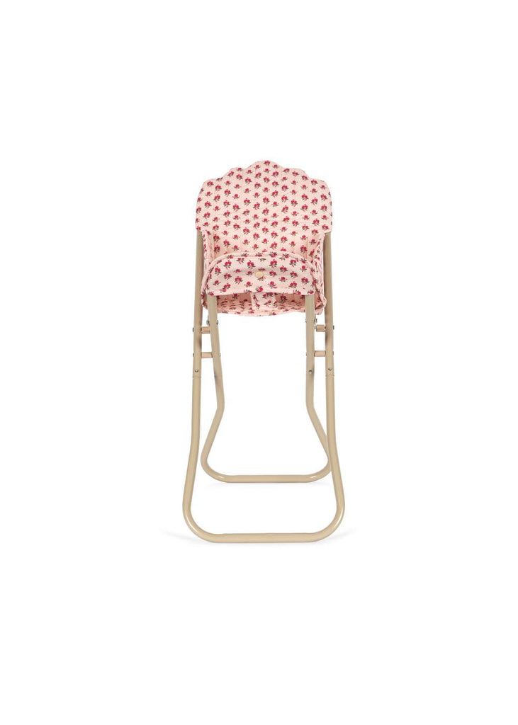The Konges Sloejd High Chair - Rosie Rose is a beige metal chair with pink floral fabric and a detachable seat, shown from the back against a white background.