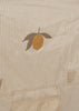 The Konges Sloejd Pop-Up Beach Tent UPF 50+ features beige fabric with thin brown stripes and a central orange graphic with two brown leaves. Visible seams and handles make it portable and ideal for sun protection at the beach.