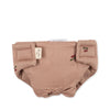 The Konges Sloejd Doll Nursery Set in Cherry Blush features a light brown diaper cover with cherry print, Velcro tabs, and a fabric brand tag on the side.