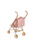The Konges Sloejd Doll Stroller - Rosie Rose features beige handles, wheels, and a pink seat with tiny red flowers. This small toy stroller is shown against a white background.