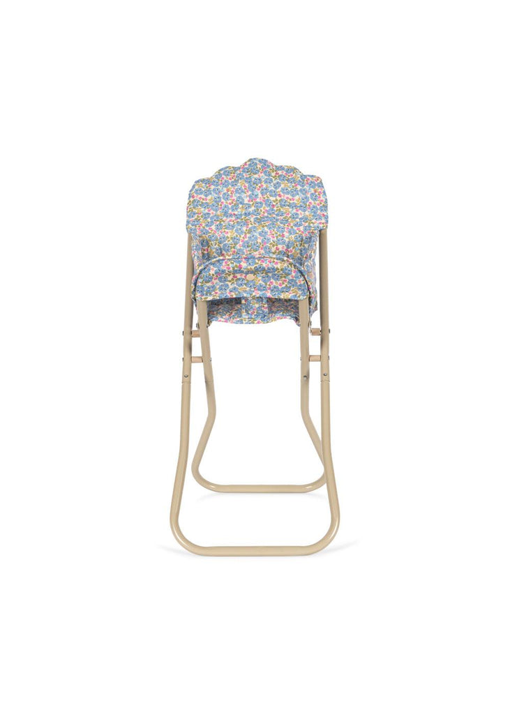 The Konges Sloejd High Chair - Rose Flower is a foldable doll high chair with a padded, detachable seat cover in a colorful floral pattern, shown folded from the front against a white background—ideal for stylish doll furniture displays.