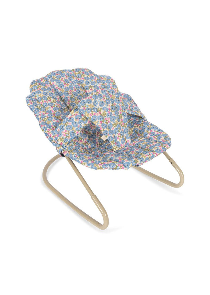 The Konges Sloejd Doll Bouncer - Rose Flower features a light metal frame and a seat in blue fabric with a colorful floral print, designed for dolls to recline comfortably.