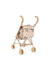 The Konges Sloejd Tulle Doll Stroller - Cherry Sequin is a compact, beige foldable stroller with quilted fabric, cherry sequin embroidery, double wheels, and curved handles, shown on a white background.