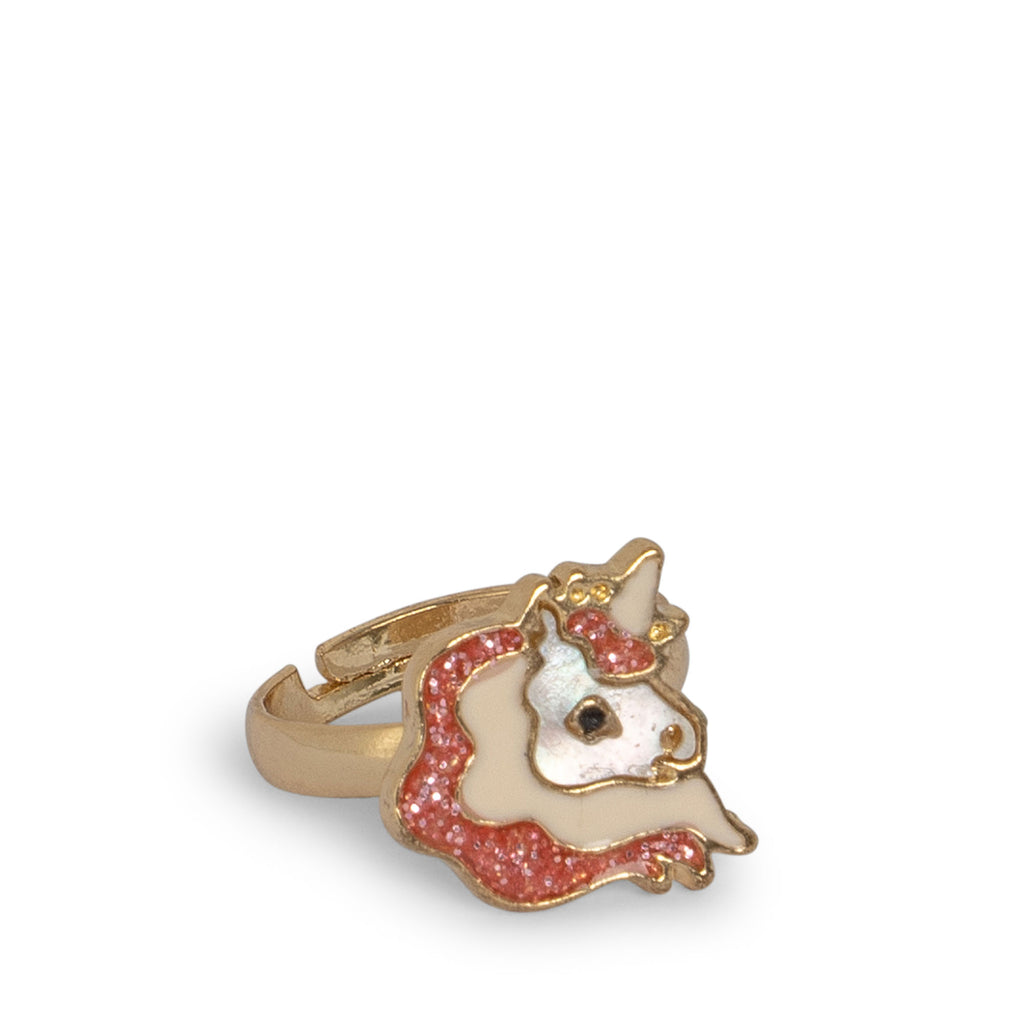 The Konges Sloejd 12 Pack Ring Set includes gold adjustable rings for kids, featuring a unicorn with a pink glittery mane, white face, and gold horn, showcased on a plain white background.