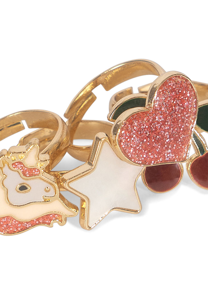 The Konges Sloejd 12 Pack Ring Set features gold-colored adjustable rings for kids, designed with playful motifs like a glittery pink heart, white star, red cherries with green leaves, and a unicorn head with pink glitter accents.