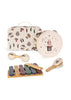 The Konges Sloejd Music Set - Circus features a charming decorated musical suitcase filled with delightful wooden instruments, including a tambourine, maracas, a xylophone with mallets, and two castanets—all adorned with whimsical animal designs and soft pastel colors. This enchanting set is perfect for inspiring little musicians.