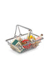 The Konges Sløjd Mini Market Grocery Set features a small metal shopping basket filled with miniature play food, including boxes, cans, bottles, and other tiny grocery items—perfect for imaginative mini market play.