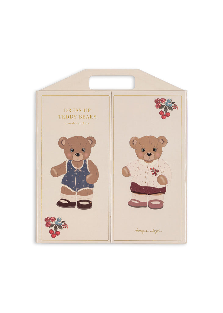 The Konges Sloejd My Sticker World Book Set - Teddy features two brown teddy bears dressed in various outfits, with charming cherry and floral decorations on the packaging. This reusable sticker set sparks creativity and fun, letting kids mix and match styles just like their own mini teddy bear sticker book.