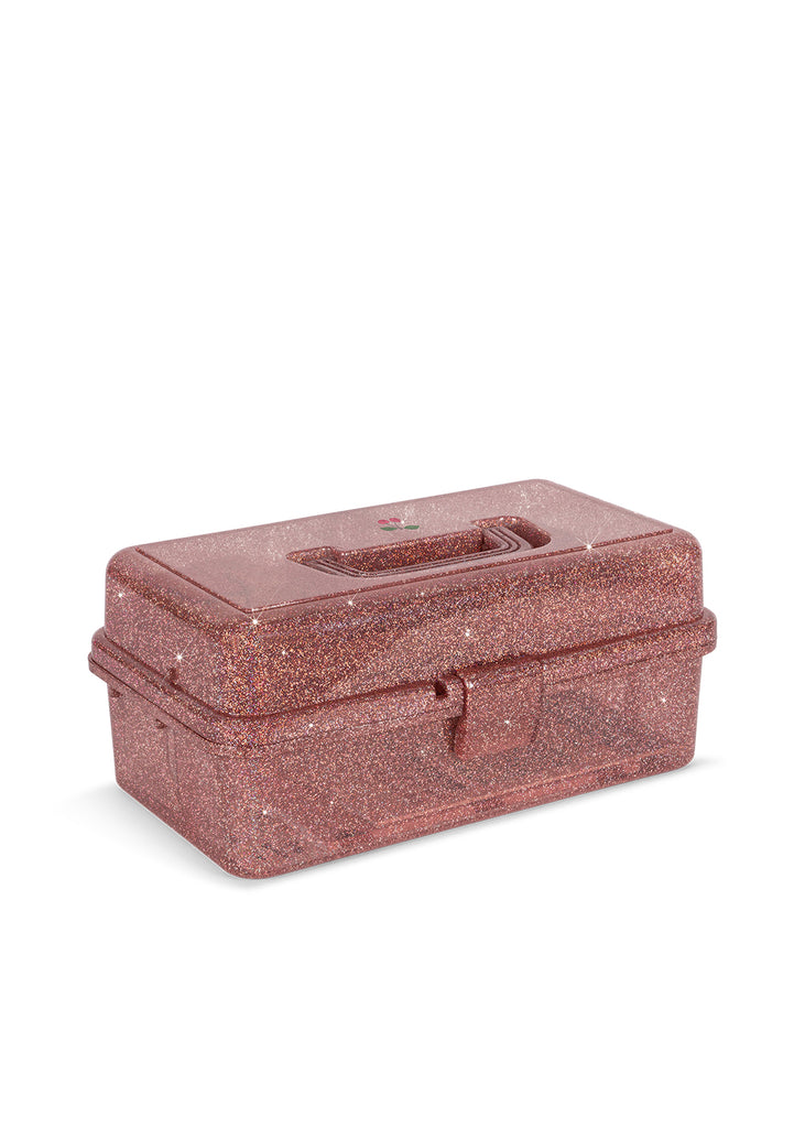 The Konges Sloejd Creative Art Caddy - Glitter Rose is a rectangular, rose gold glittery plastic box featuring a convenient top handle and secure front latch, set against a white background—an eye-catching organizer perfect for kids’ art supplies or your favorite coloring set.