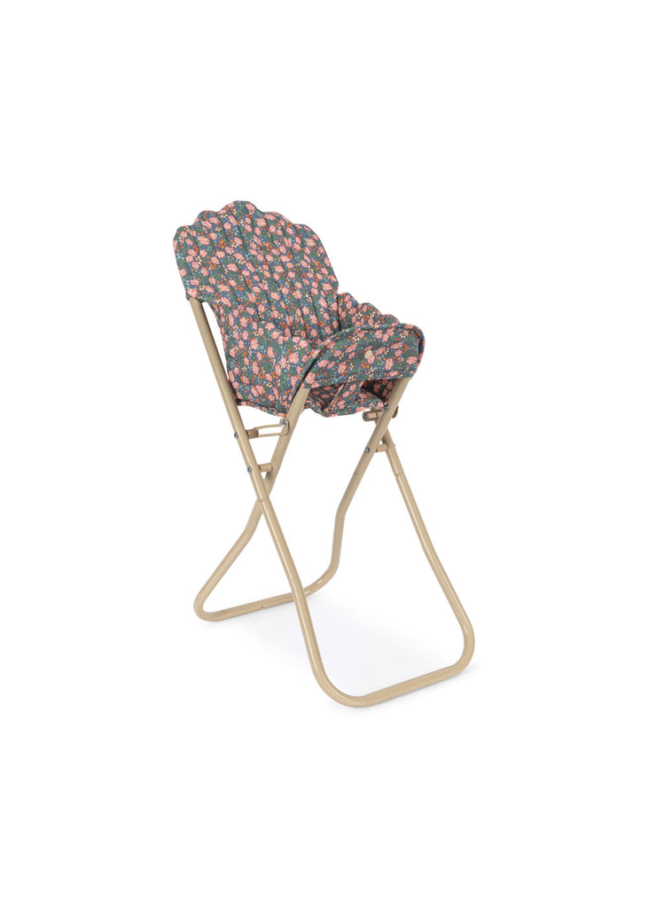 The Konges Sloejd High Chair - Kyoto is a foldable doll high chair with a beige metal frame and a seat/backrest in pink and green floral fabric, perfect for charming doll furniture collections.