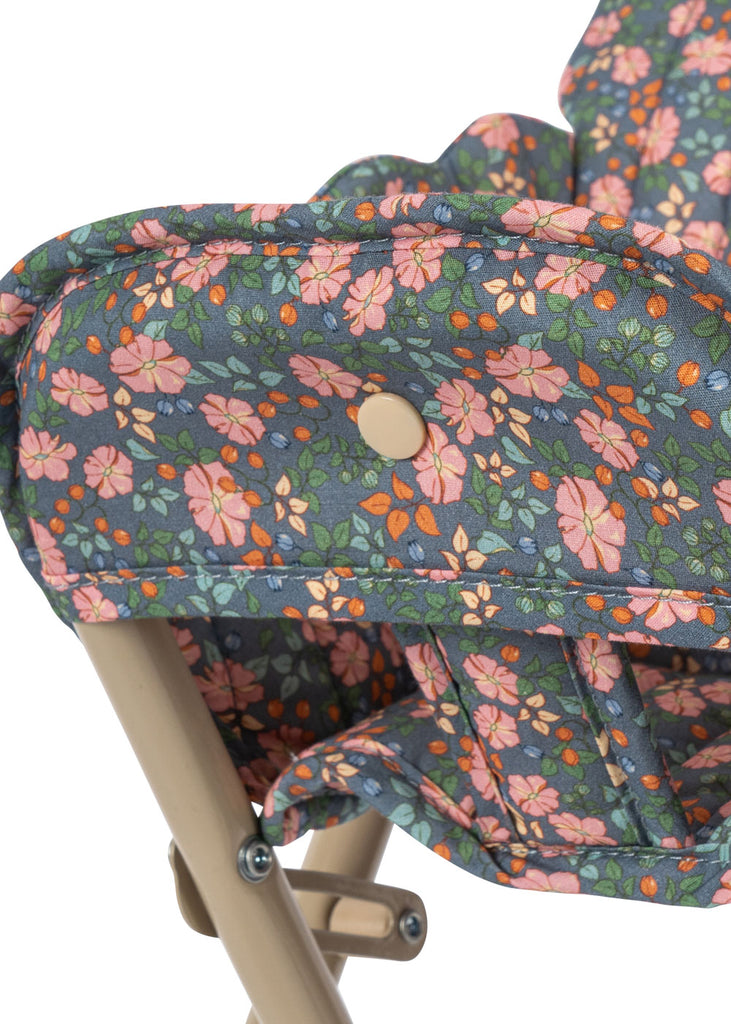 Close-up of the Konges Sloejd High Chair - Kyoto, a foldable doll high chair with a beige metal frame and fabric seat decorated in a colorful Kyoto floral pattern—an adorable addition to any doll furniture collection.