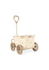 A Konges Sloejd Stoller Kids Wagon - Cherry is displayed on a white background, featuring a beige fabric body with a subtle print, four large wheels, and a tall handle.