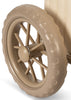 Close-up of a beige plastic wheel with a textured tread and multiple spokes, attached to the light-colored frame of the Konges Sloejd Stroller Kids Wagon - Cherry, typical of a children’s stroller or toy wagon.