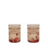 The Konges Sloejd Glitter Cups - Cherry (2 Pack) feature a light brown tint with cherry-themed floral designs, making them a charming and stylish addition to any kids drinkware collection. Perfect for fun mealtimes on a plain white background.